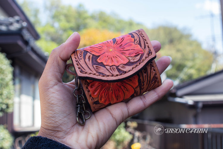 Handmade tooled leather Air Pod case by Bison Cabin, inspired by cowgirl style and Western heritage. Expertly crafted with intricate detailing and high quality leather.